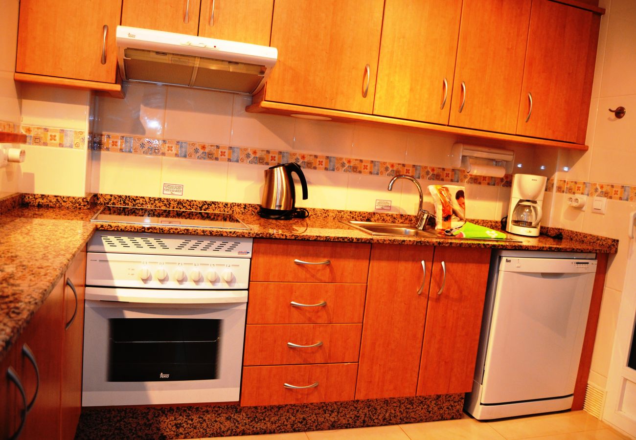 Gran cocina con electrodomésticos modernos - Resort Choice
